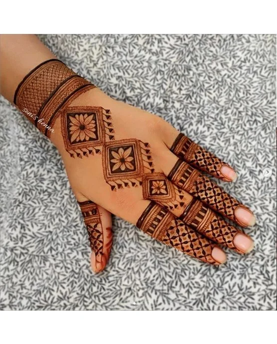 Cultural Swirl With Hatch Covering Back Hand Mehndi Design